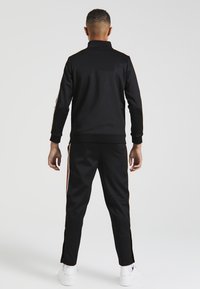 SIKSILK Pantalones deportivos - black