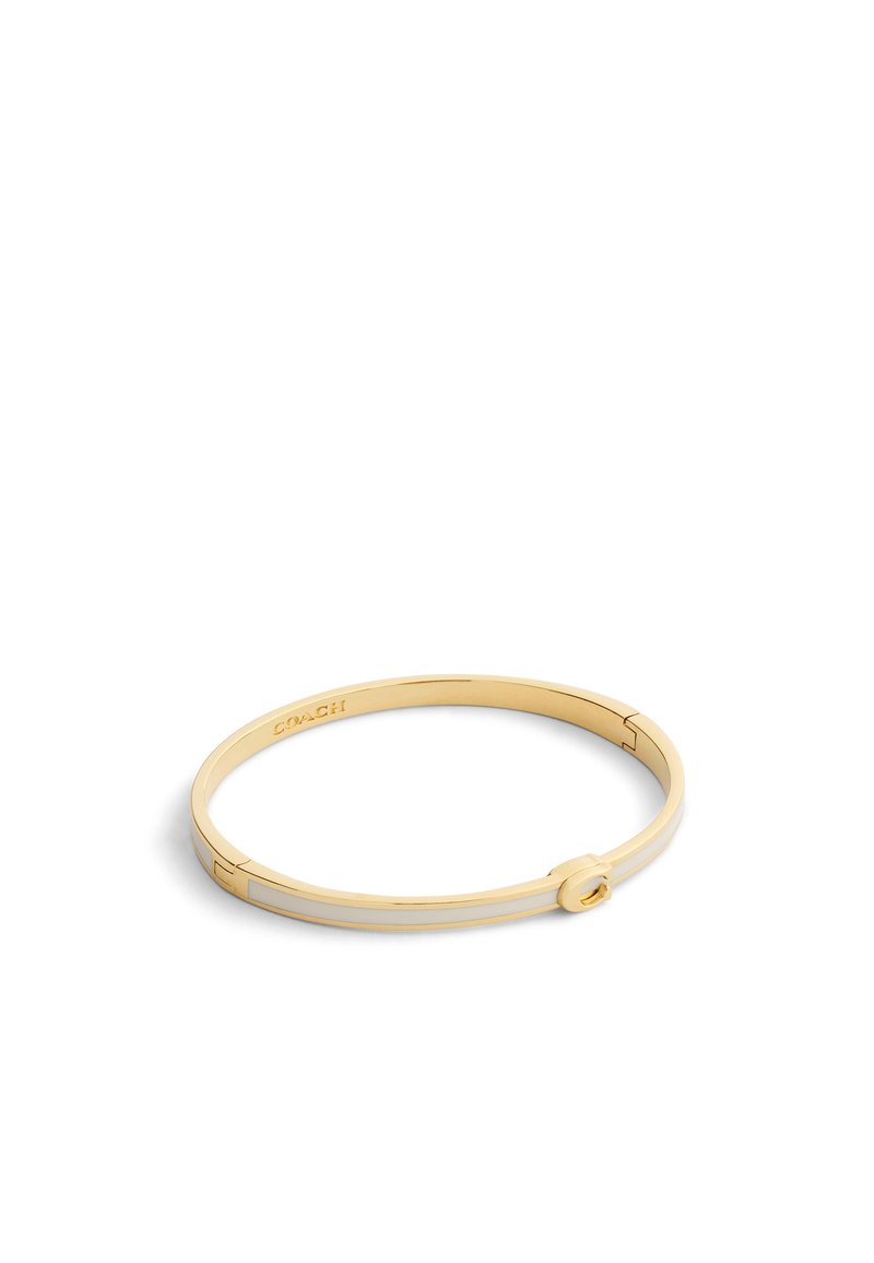 Guldtonat banglearmband med en slät yta, cirkulär låsning och minimalistisk design med ingraverade detaljer.