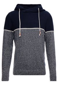 Bluza z kapturem z wzorami dzianiny w kolorze granatowym i teksturowanym szarym, z kontrastującą górną częścią i białymi sznurkami.