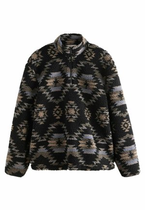 Sort og tan zippered pullover lavet af tekstureret fleece, der har et abstrakt, geometrisk mønster med blå accenter.
