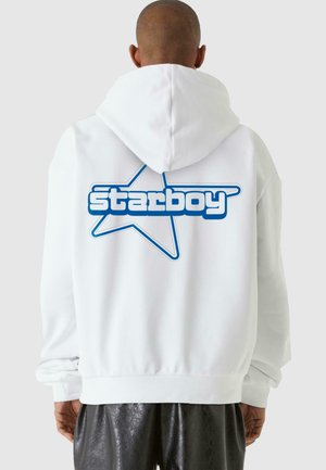 White hooded sweatshirt featuring a blue "starboy" logo with a star outline, showing a smooth texture and relaxed fit design.