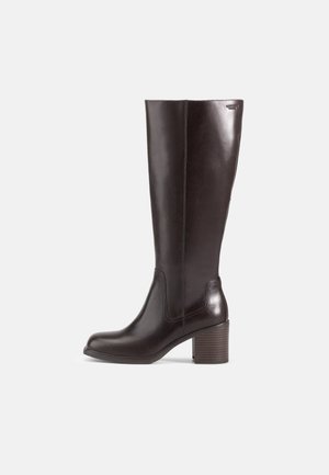 Brown leather knee-high boot with a smooth texture, square toe, and a stacked wooden heel. Features minimal stitching and side panels.