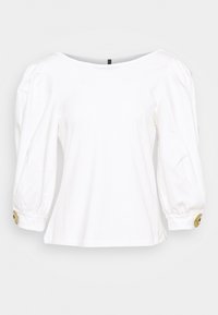 Vit långärmad blus med rundad halsringning, puffärmar och guldbuttonsdetaljer vid ärmsluten. Slät tyg med avslappnad passform.