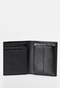 Black leather wallet with an open design, featuring multiple card slots, smooth texture, and clean stitching without visible hardware.