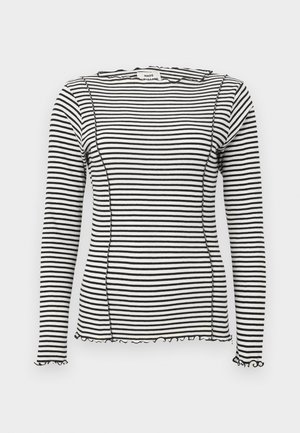 Striped long-sleeve top in black and white, featuring a ribbed texture, scalloped edges, and contrast stitching along the seams.