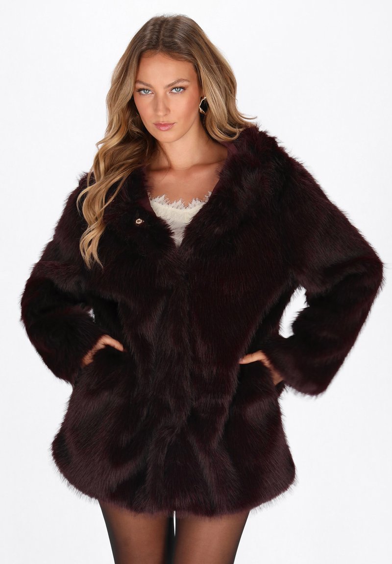 Burgundy faux fur coat with long sleeves, a v-neckline, and a button closure. Features a soft texture and side pockets.