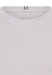Lichtgrijze t-shirt met ronde hals, gemaakt van katoen. Bevat zichtbare stiksels en een korte rits aan de achterkant.