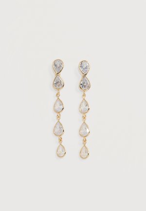 Gold drop earrings with four linked clear teardrop-shaped gemstones, displayed on a plain light background.