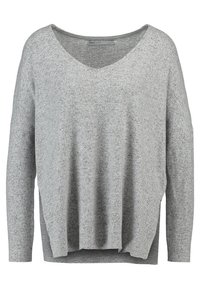 Maglione grigio a maglia con scollo a V, design loose-fit, spalle scese e spacchi laterali. Materiale testurizzato con un motivo sottile su tutto il capo.