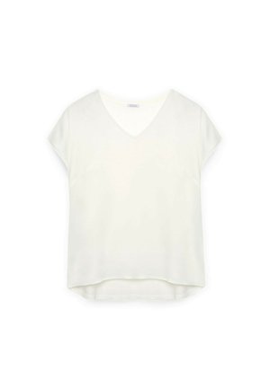 Top blanco de manga corta con escote en V, hecho de una tela suave. Presenta un ajuste holgado y un dobladillo ligeramente curvado.