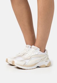 Puma TEVERIS NITRO SELFLOVE warm white/beige Zalando UK