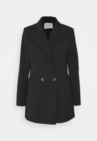 Blazer nero sartoriale con design doppiopetto, rever a lancia, due tasche frontali e bottoni metallici. Tessuto dalla texture liscia.