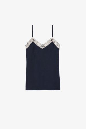 Caraco bleu marine avec fines bretelles et délicate dentelle blanche le long du décolleté en V et des bords supérieurs.