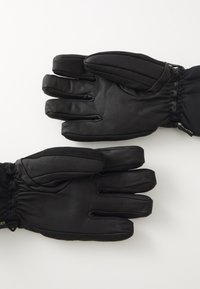 Guanti in pelle nera con un design a cinque dita, polso elastico e superficie texturizzata con etichetta GORE-TEX. Morbidi e isolati.