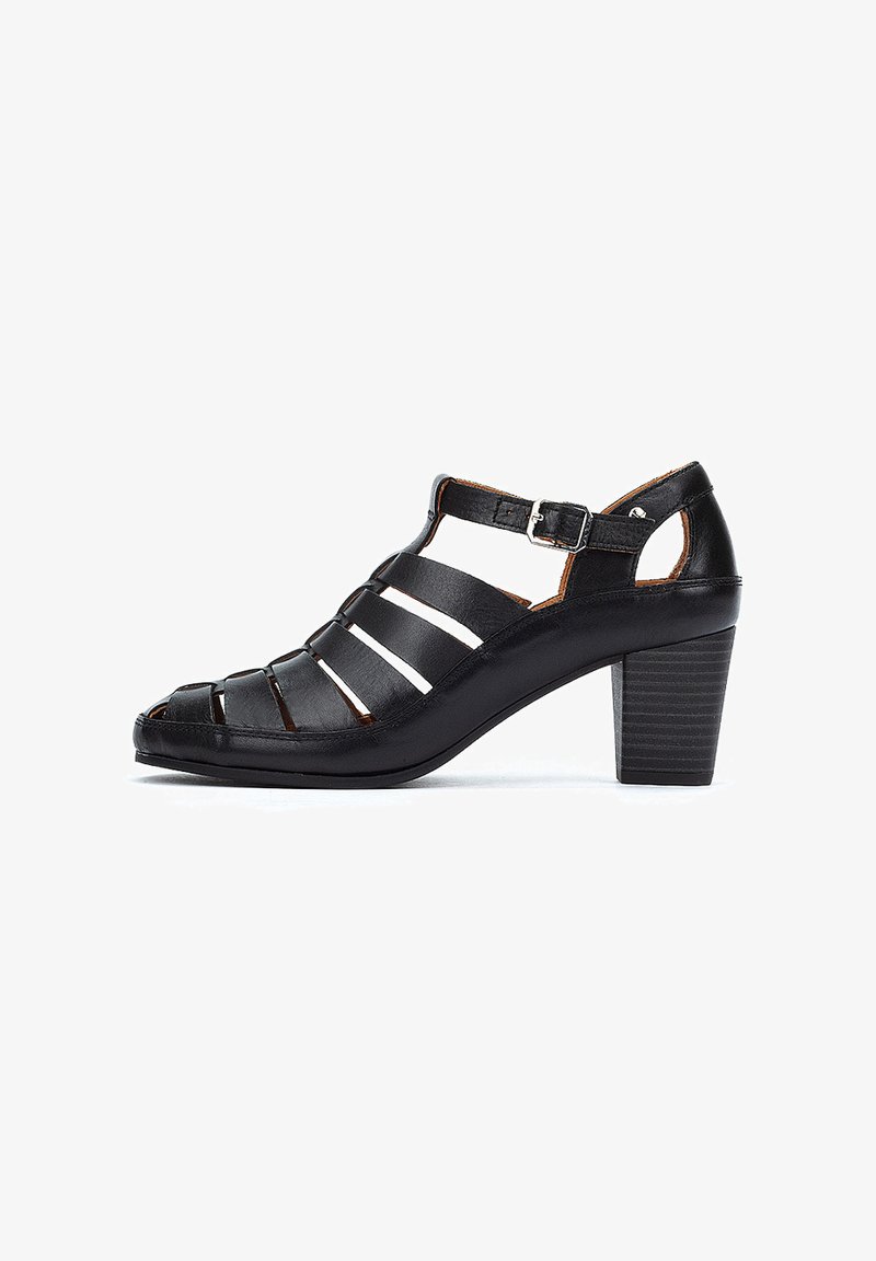 Black leather heeled sandals with open toe, featuring multiple straps, adjustable ankle buckle, and a textured block heel.