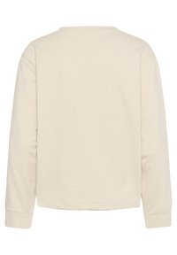 Maglietta a maniche lunghe color beige chiaro con scollo rotondo, realizzata in tessuto morbido. Presenta spalle cadute e una vestibilità rilassata. Design semplice e senza decorazioni.