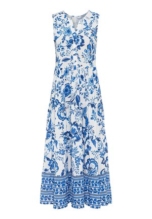 Robe longue blanche sans manches avec motifs floraux et feuillages bleus, col en V avec boutons et jupe à volants avec ourlet à motifs.