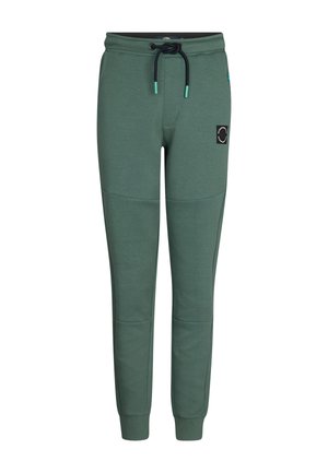 Pantaloni della tuta verdi con cintura elastica, cordino regolabile, tasche laterali e una patch decorativa sulla coscia sinistra.