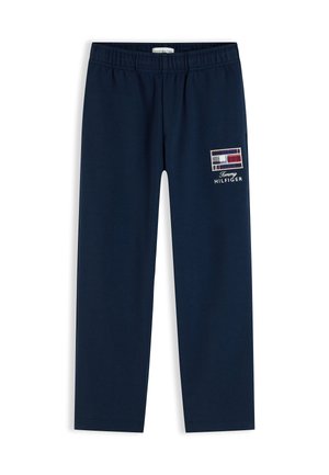 Mørkeblå Tommy Hilfiger bukser med elastik i taljen og logo på den øverste lårdel.