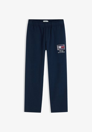 Mørkeblå Tommy Hilfiger bukser med elastik i taljen og logo på den øverste lårdel.