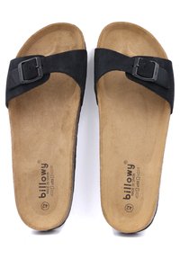 Sandales à glissière en daim noir avec une boucle, présentant un semelle intérieure contournée marron et une base texturée, étiquetées pour la taille 42, marque "billowy".