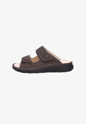 Brown leather slide sandal with dual adjustable Velcro straps, light interior, and a black, textured rubber sole.