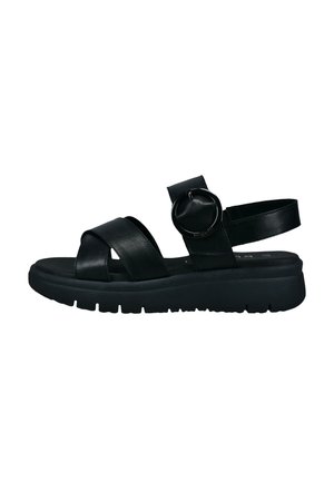 Black leather sandals with crisscross straps, circular hardware detail, a cushioned sole, and textured grip treads.