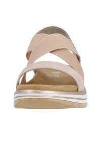 Pink sandal with crisscross fabric straps and a padded, beige insole. Features a cushioned sole with a subtle white and beige striped design.