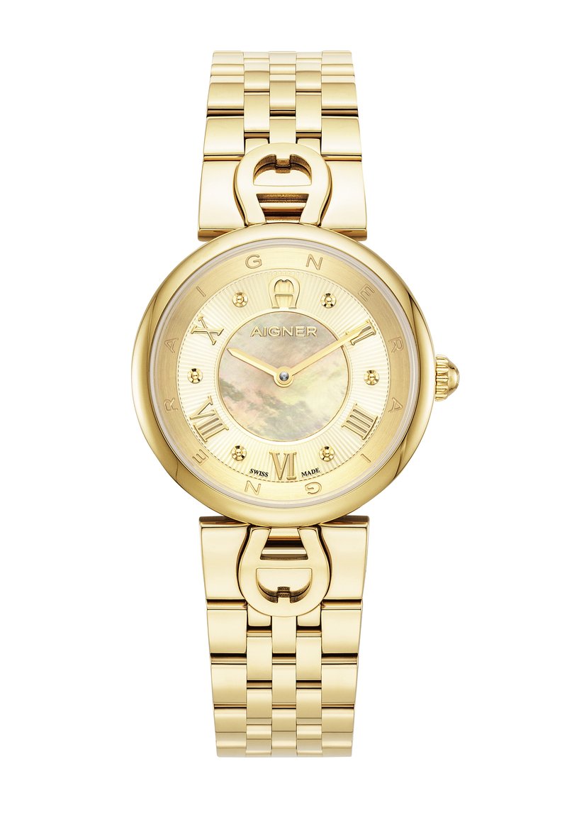 Kultakuvioinen kello, jossa on pyöreä kuori, metallinen hihna ja helmimäinen näyttö. Varustettu roomalaisilla numeroilla ja logolla keskellä.