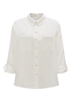 Camicia bianca con bottoni realizzata in tessuto liscio, dotata di collo a punta, due tasche sul petto e maniche arrotolate con dettaglio a bottone.