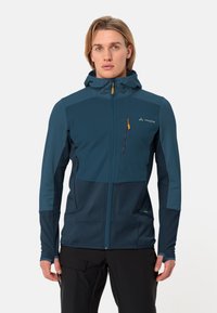 Giacca con cappuccio da uomo, blu scuro, tessuto leggero, pannello frontale trapuntato, tasche con zip, polsini elasticizzati, orlo regolabile, branding minimale.