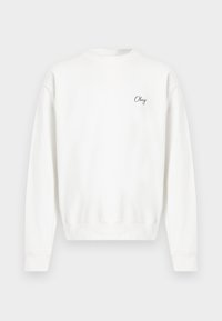 Λευκό φούτερ από μαλακό ύφασμα, με στρογγυλή λαιμόκοψη και ριμπ μανσέτες. Η λέξη «Obey» είναι κεντημένη σε απλό, καλλιγραφικό γραμματοσειρά στο στήθος.