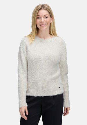 Helle beige Strickjacke aus strukturiertem, flauschigem Material mit geripptem Saum und Bündchen. Crew-Neck-Design mit minimaler Detailgestaltung.