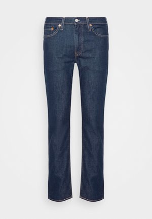 Donkerblauwe jeans van denim, met een rechte pasvorm, contrasterende stiksels, vijf zakken en een ritssluiting met knoopsluiting.