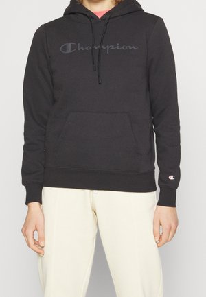 Felpa con cappuccio nera in misto cotone, dotata di tasca a marsupio frontale e logo "Champion" tono su tono sul petto. Polsini e orlo a coste.