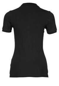 Polo noir à manches courtes, col et coupe ajustée. Confectionné en tissu doux et extensible, sans motifs ni accents visibles.