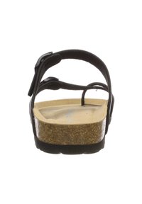 Černé sandály s korkovou stélkou, nastavitelné popruhy a texturovanou podešví. Nabízí plochý design a minimalistický styl.