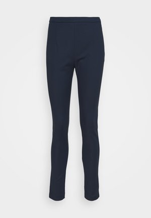 Navy blue fitted trousers with a smooth texture, featuring a high waistband and subtle front pleats, designed for a tailored look.