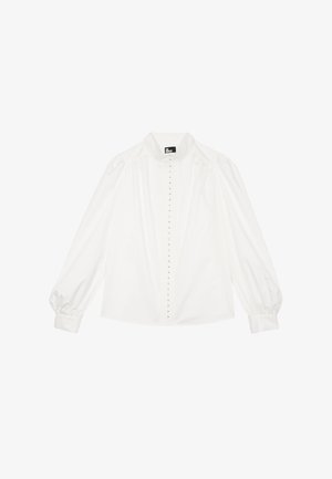 Blusa bianca a maniche lunghe con maniche a sbuffo, chiusura frontale con bottoni e piccolo colletto alla coreana.