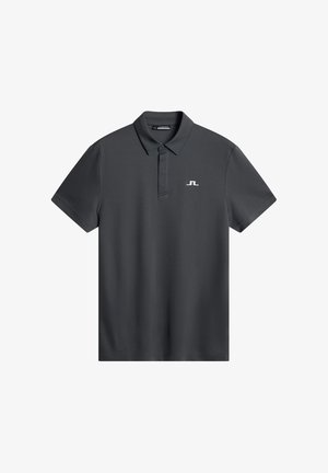 Ciemnoszara koszulka polo z gładkiego materiału, z kołnierzykiem, krótkimi rękawami i małym białym logo na lewej piersi.