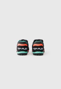 Black athletic shoes with orange and turquoise accents, textured mesh upper, and patterned soles. Branding visible: "TOP-FLEX" on the heel.