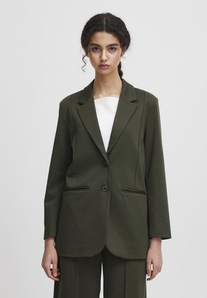 Olivově zelený blazer vyrobený z texturované tkaniny, s klopovým límcem, dvěma předními kapsami a dvouřadým zapínáním. Navržen s volným střihem.