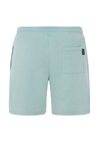 Lichtblauwe shorts van zacht materiaal, voorzien van een achterzak, elastische tailleband en stikselaccenten. Eenvoudig ontwerp, knielange snit.