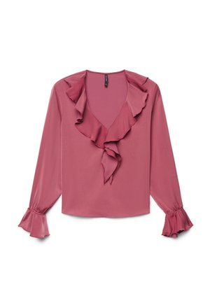 Blouse rose poudré à manches longues avec col en V bordé de volants et poignets volantés, posée à plat sur fond blanc.
