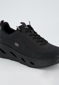 Black athletic shoe featuring a textile upper, round toe, lace-up closure, and air-cushioned sole with ventilation cutouts.