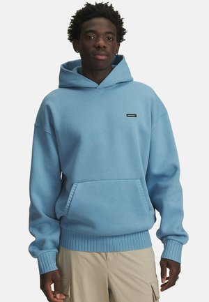 Light blue hoodie made of soft fabric, featuring a front pouch pocket, ribbed cuffs and hem, with a small black logo on the chest.