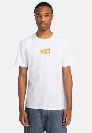 White short-sleeve t-shirt with three graphic squares in green and orange featuring simple symbols, made from cotton fabric.