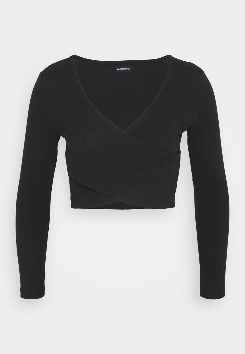 Svart ribbad långärmad wrap-top med djup V-ringning och kort design. Slät textur med en figurnära silhuett.