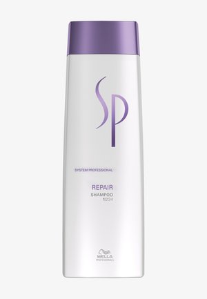 White shampoo bottle with purple cap labeled "SP Repair Shampoo" by Wella Professionals.