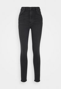 Vaqueros skinny negros de cintura alta, fabricados en denim. Cuentan con cinco bolsillos y un cierre clásico de botón y cremallera. Textura suave.